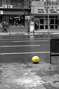 Yellow smiley on street