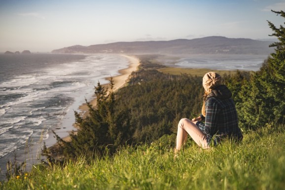 woman looking out on coast nature outdoor