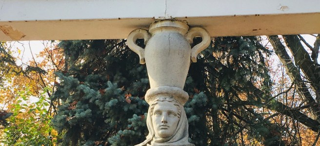 statue of a woman holding urn on her head
