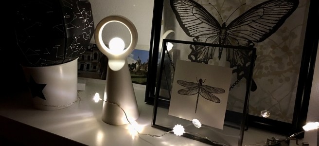 stringed lights before decorations at night in dark room